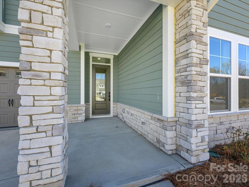 Exterior details and patio area of a home in North Creek Village, Huntersville (Image 22).