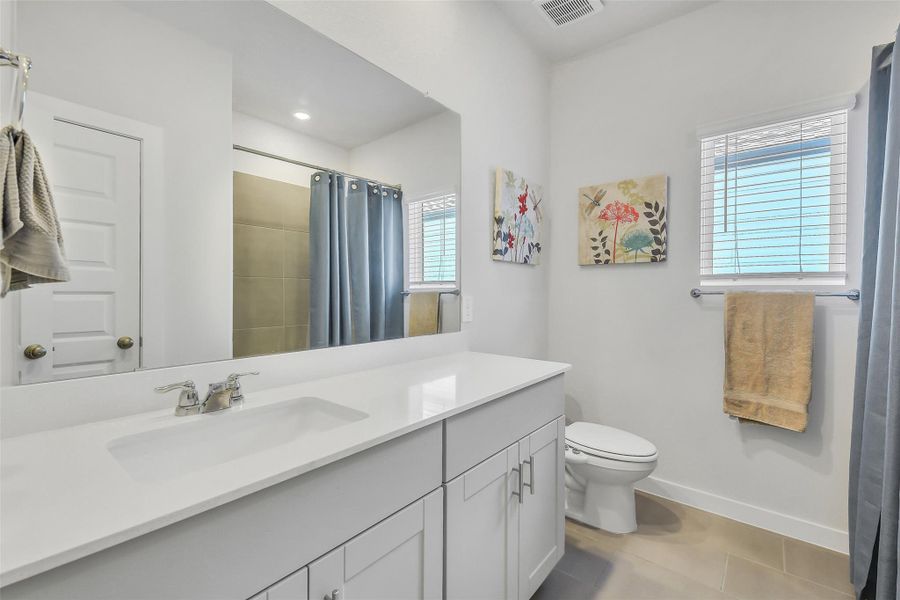 Beautifully finished secondary bathroom featuring contemporary fixtures, clean lines, and functional design.