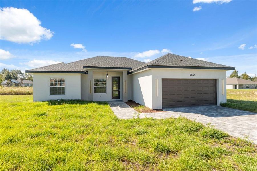 Front exterior of a new home in , Ocala, FL, highlighting curb appeal (Image 21).