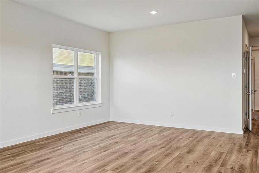 Empty room featuring light hardwood / wood-style flooring