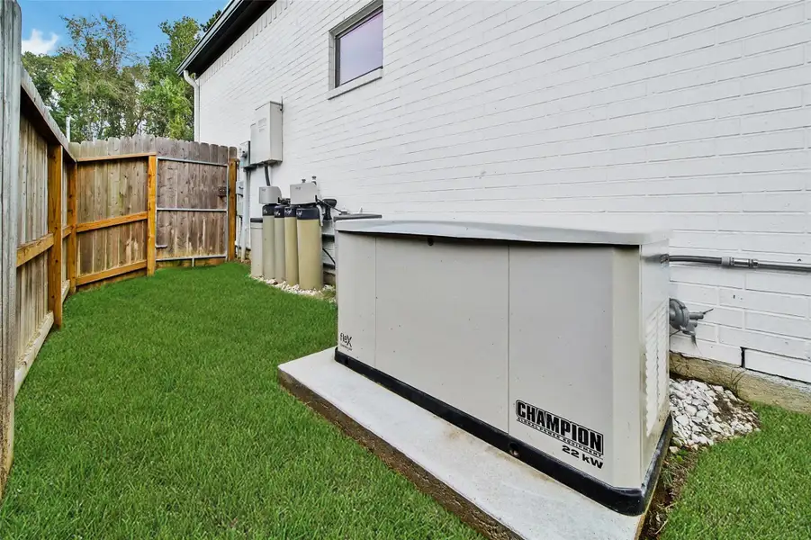 Exterior details and patio area of a home in ARTAVIA, Conroe (Image 25).