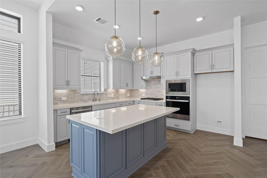 This spacious kitchen has it all—ample storage, generous counter space, and a layout that truly makes it the heart of the home. This spacious kitchen has it all—ample storage, generous counter space, and a layout that truly makes it the heart of the home.