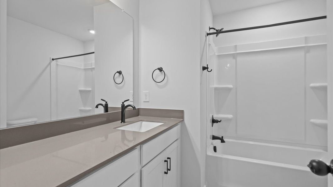 Notable full bathroom offering tasteful details and a bright, functional space Notable full bathroom offering tasteful details and a bright, functional space