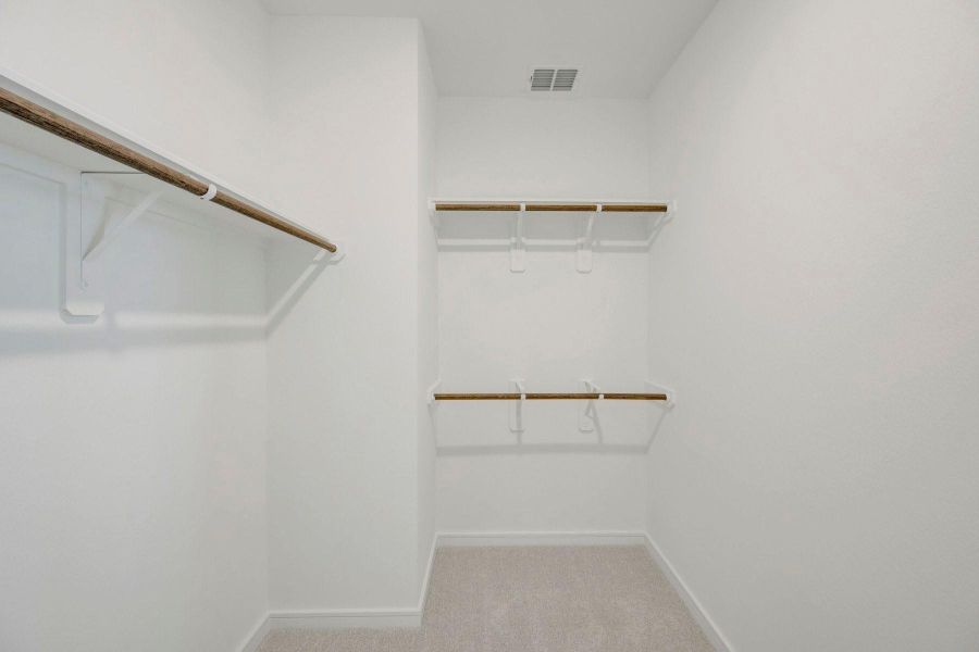 Primary walk-in closet Primary walk-in closet