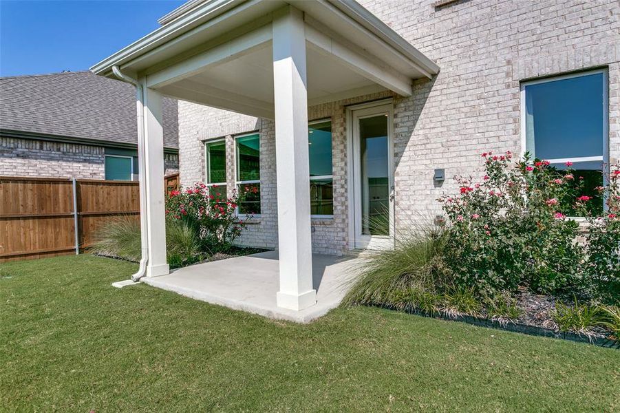 Exterior details and patio area of a home in The Preserve, Justin (Image 19).