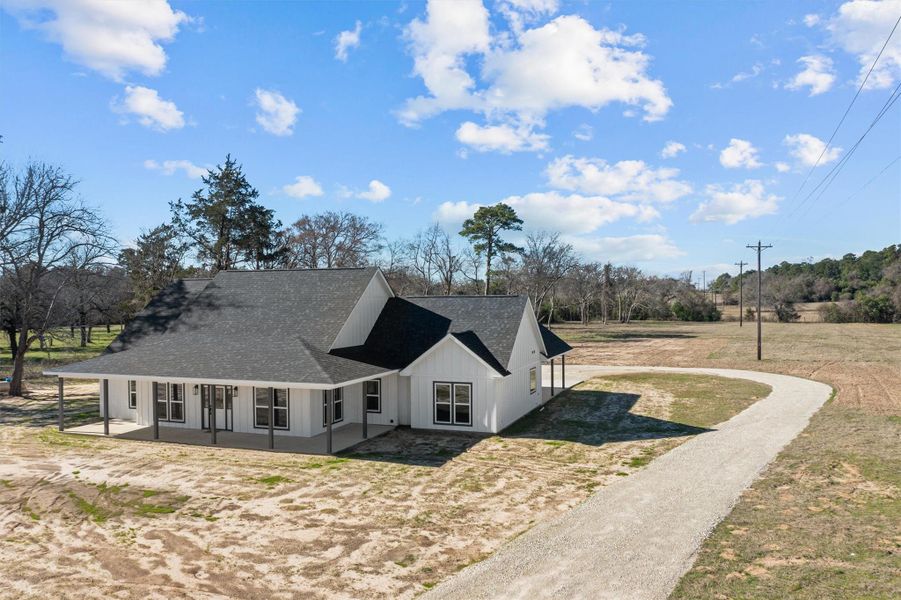Front exterior of a new home in , Grapeland, TX, highlighting curb appeal (Image 2).