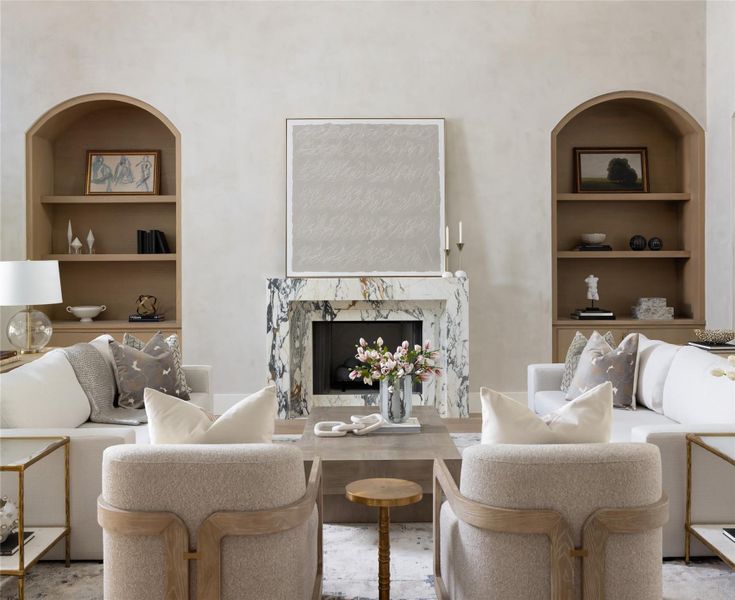 The living room boasts 23-foot Venetian plaster walls, creating an inviting and elegant atmosphere.A custom marble-accented fireplace anchors the space, offering warmth and sophistication. The living room boasts 23-foot Venetian plaster walls, creating an inviting and elegant atmosphere.A custom marble-accented fireplace anchors the space, offering warmth and sophistication.