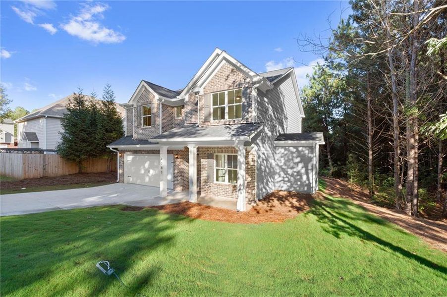 Front exterior of a new home in , Douglasville, GA, highlighting curb appeal (Image 2). Front exterior of a new home in , Douglasville, GA, highlighting curb appeal (Image 2).