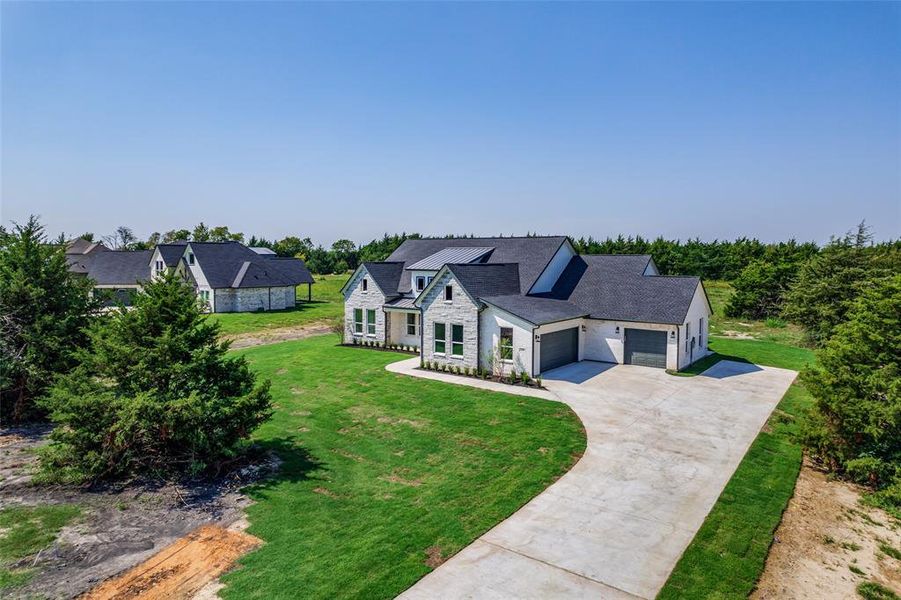 Front exterior of a new home in , Farmersville, TX, highlighting curb appeal (Image 26).