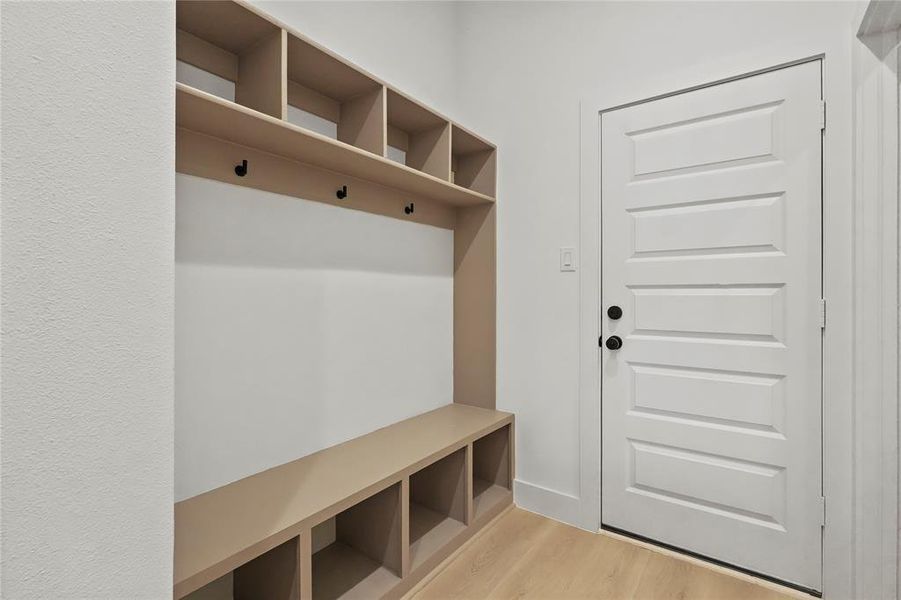 Mudroom featuring light wood-style flooring