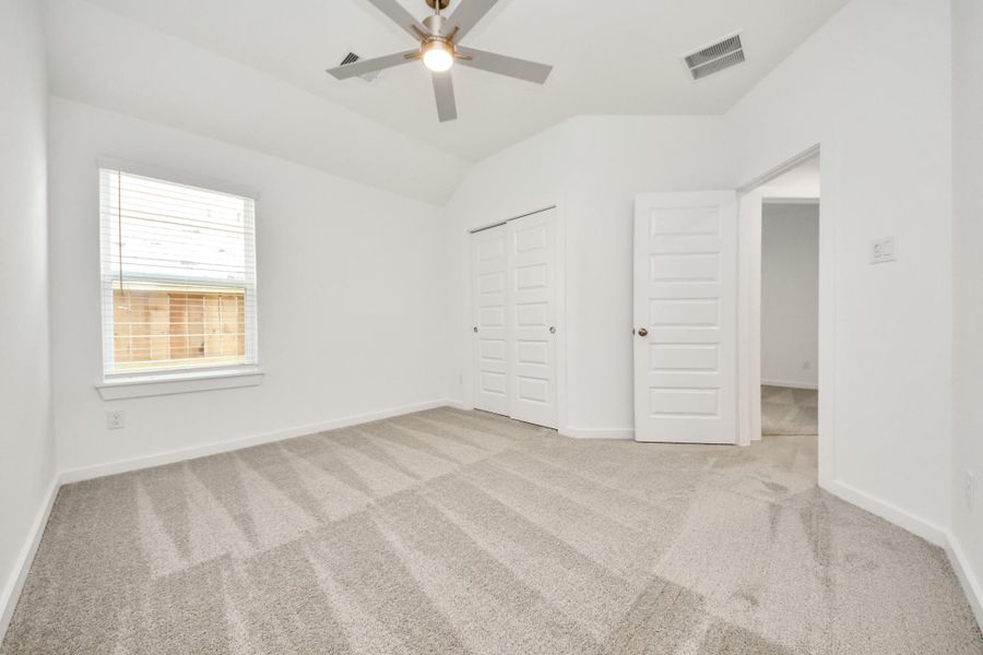 Generously sized secondary bedrooms featuring spacious closets, soft and inviting carpeting underfoot, large windows allowing plenty of natural light, and the added touch of privacy blinds for your personal retreat. Sample photo of completed home with similar floor plan. Actual colors and selections may vary. Generously sized secondary bedrooms featuring spacious closets, soft and inviting carpeting underfoot, large windows allowing plenty of natural light, and the added touch of privacy blinds for your personal retreat. Sample photo of completed home with similar floor plan. Actual colors and selections may vary.