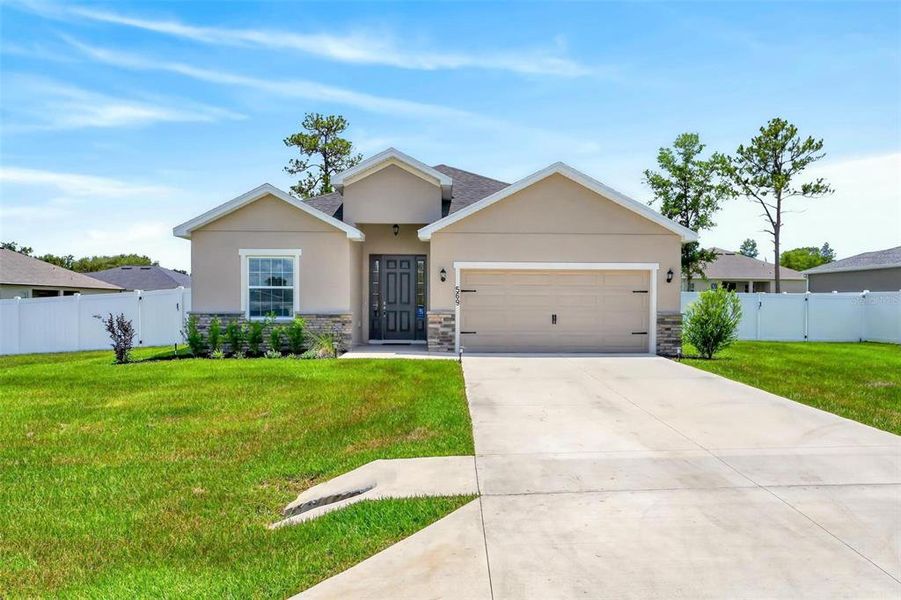 Front exterior of a new home in Silver Springs Shores, Ocala, FL, highlighting curb appeal (Image 31). Front exterior of a new home in Silver Springs Shores, Ocala, FL, highlighting curb appeal (Image 31).