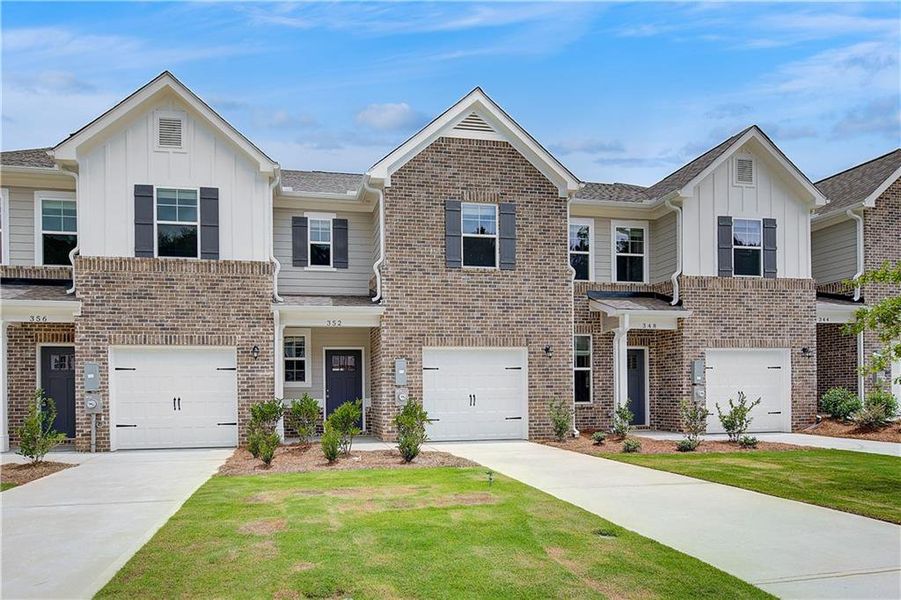 Front exterior of a new home in Avery Landing, McDonough, GA, highlighting curb appeal (Image 2).