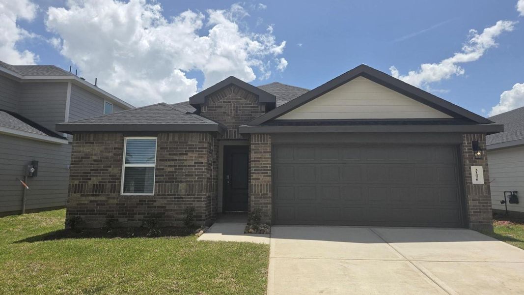 Front exterior of a new home in Tamarron, Fulshear, TX, highlighting curb appeal (Image 1). Front exterior of a new home in Tamarron, Fulshear, TX, highlighting curb appeal (Image 1).