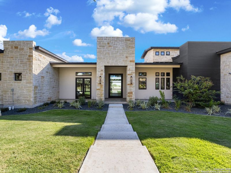 Front exterior of a new home in , Canyon Lake, TX, highlighting curb appeal (Image 2). Front exterior of a new home in , Canyon Lake, TX, highlighting curb appeal (Image 2).