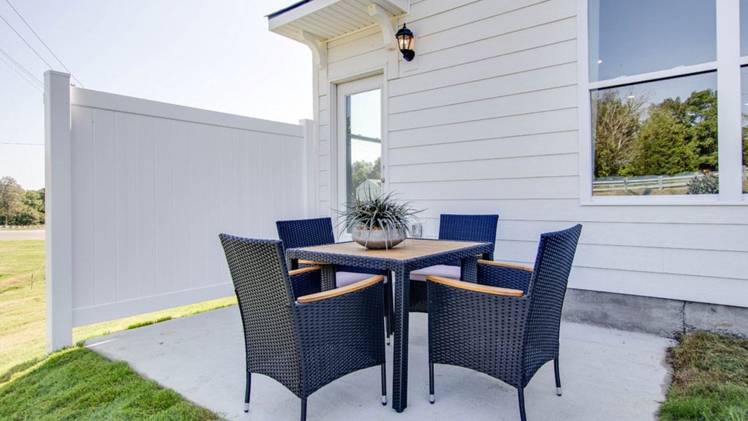 Exterior details and patio area of a home in River Landing Townhomes, Murfreesboro (Image 2).
