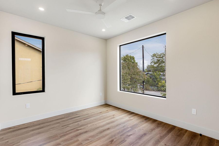 Unfurnished room featuring light wood-style floors, recessed lighting, and ceiling fan