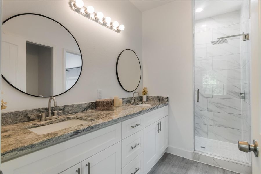 double vanity and a walk-in shower in the primary bathroom. double vanity and a walk-in shower in the primary bathroom.