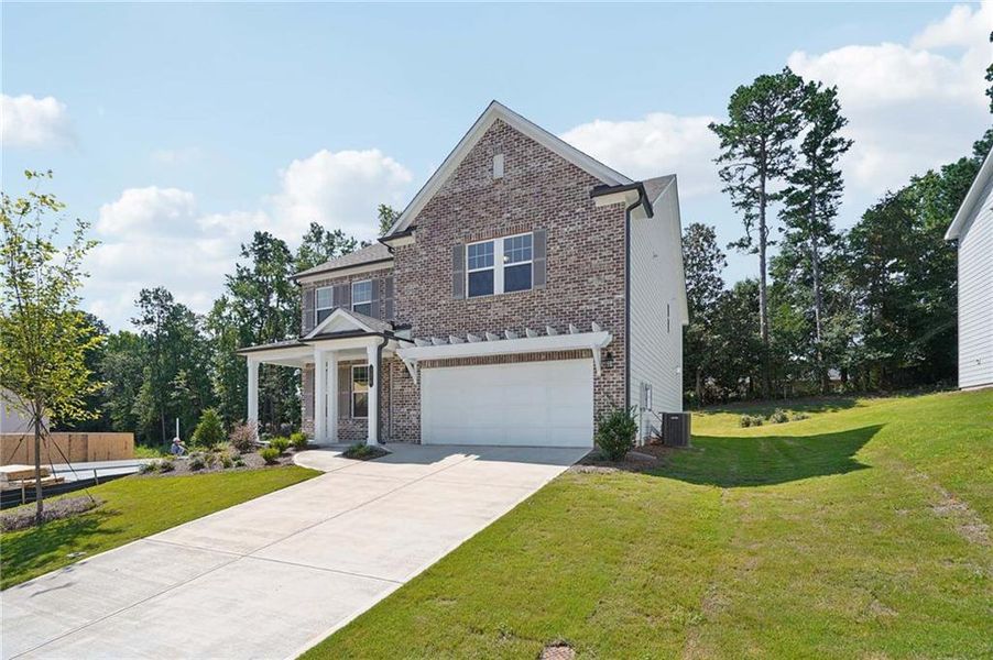 Front exterior of a new home in The Estates at Casteel, Bethlehem, GA, highlighting curb appeal (Image 20).