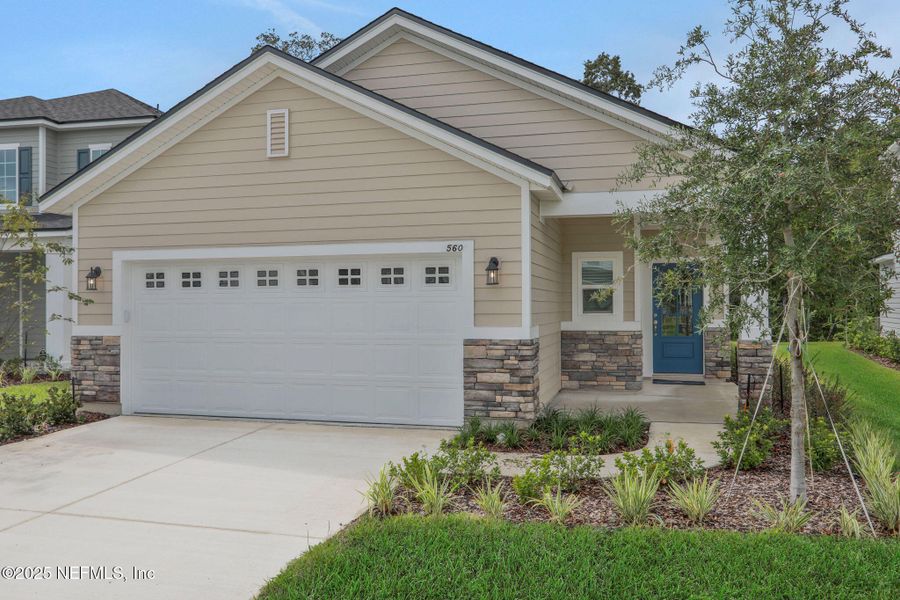 Front exterior of a new home in TrailMark, St. Augustine, FL, highlighting curb appeal (Image 19). Front exterior of a new home in TrailMark, St. Augustine, FL, highlighting curb appeal (Image 19).