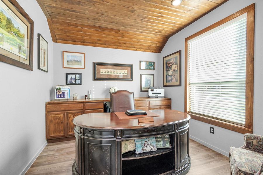 Custom wood-panel ceiling and matching built-ins