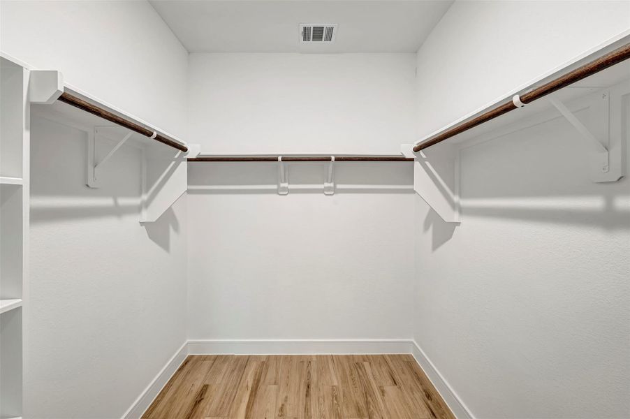 Primary walk-in closet (*Photo not of actual home and used for illustration purposes only.)