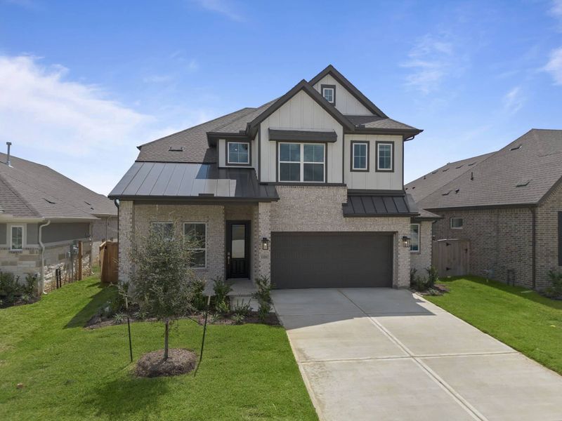 Front exterior of a new home in Wood Leaf Reserve, Tomball, TX, highlighting curb appeal (Image 21).
