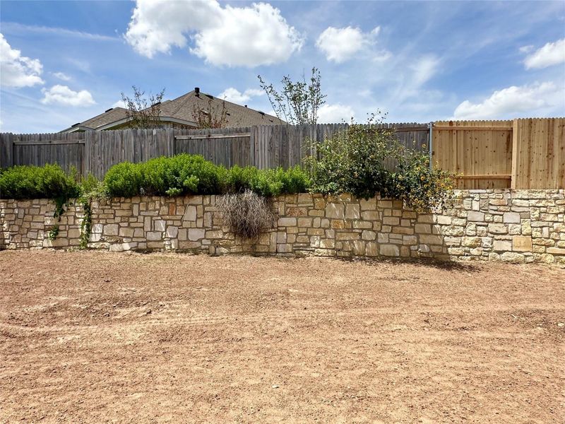 View of fenced backyard