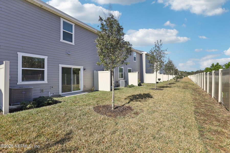 Exterior details and patio area of a home in Orchard Park Townhomes, St. Augustine (Image 3). Exterior details and patio area of a home in Orchard Park Townhomes, St. Augustine (Image 3).