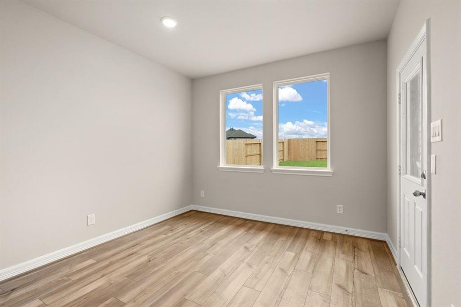 With an abundance of natural light streaming through the windows, the breakfast nook is bathed in a sunny glow, creating the perfect atmosphere to enjoy your morning coffee or a family breakfast.