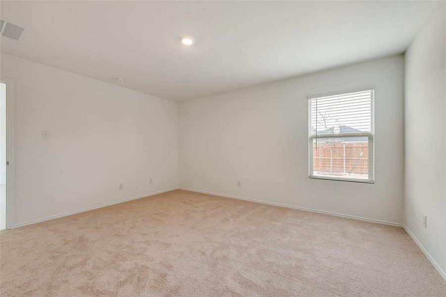 Spare room with light colored carpet