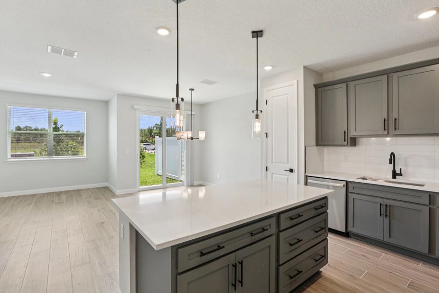 Kitchen opens up into the dining room and family room space - Representative images and renderings are for illustrative purposes