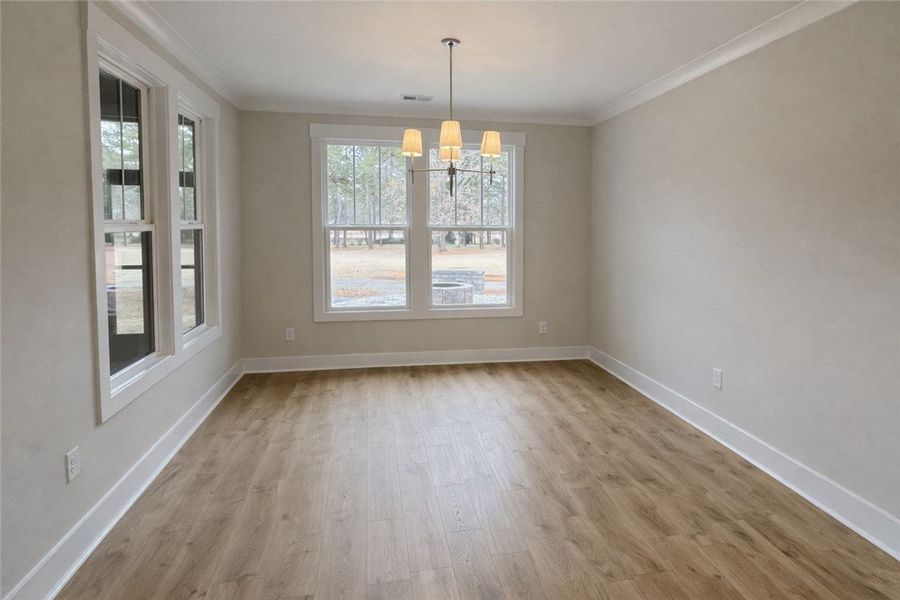 This bright space offers rich wood floors and abun
