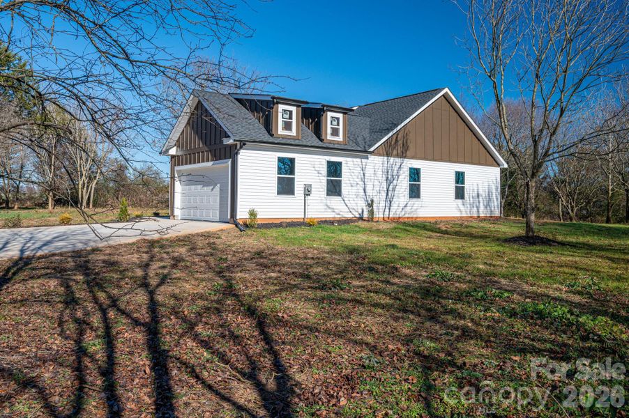Front exterior of a new home in , Shelby, NC, highlighting curb appeal (Image 27).