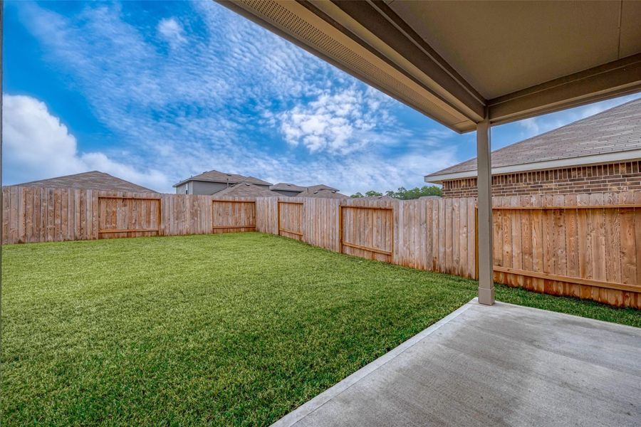 Exterior details and patio area of a home in Breckenridge Forest, Spring (Image 3).