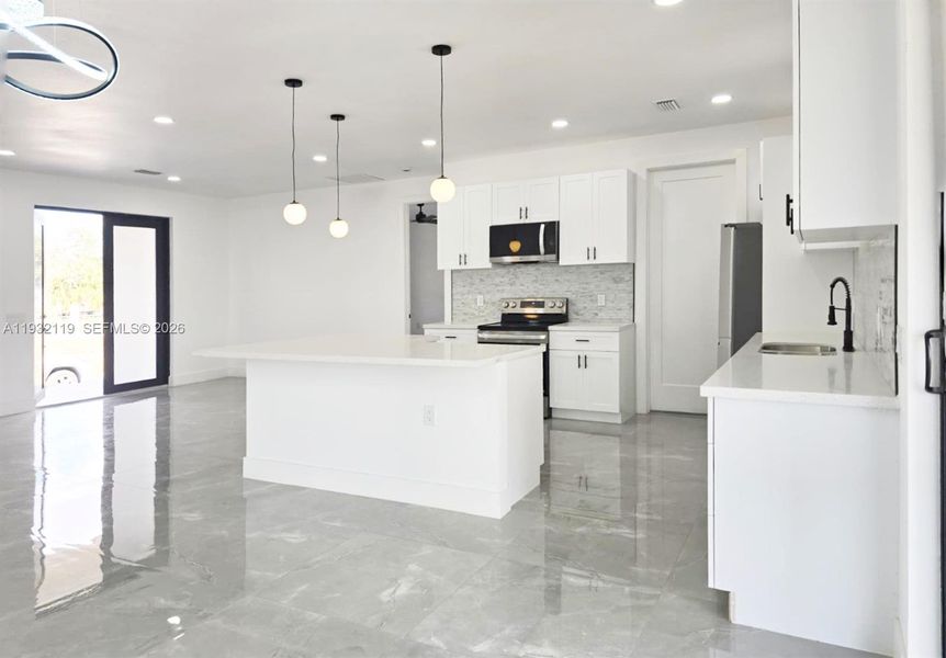 Furnished interior view inside a new home in , Clewiston (Image 9).