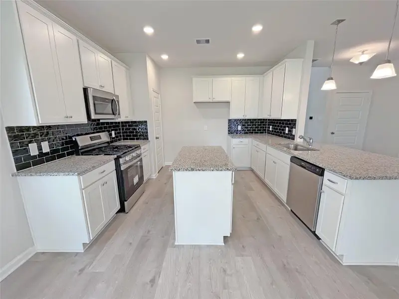 The Georgetown II- Kitchen. Sample image for illustration; upgrades, options, and colors may vary.
