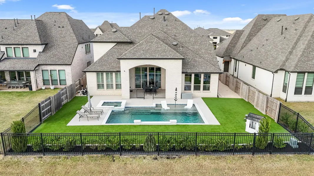 Imagine the amount of family time you’ll spend eating meals under the covered patio, swimming and sun bathing by the pool or relaxing in the heated spa. You will love entertaining your friends and family in this yard!