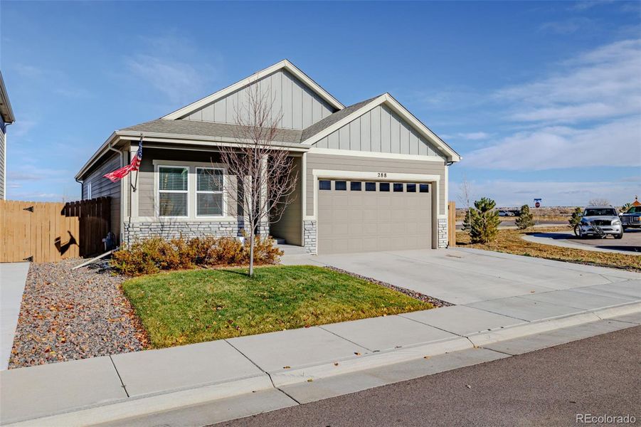 Front exterior of a new home in Lochbuie Station, Lochbuie, CO, highlighting curb appeal (Image 22). Front exterior of a new home in Lochbuie Station, Lochbuie, CO, highlighting curb appeal (Image 22).