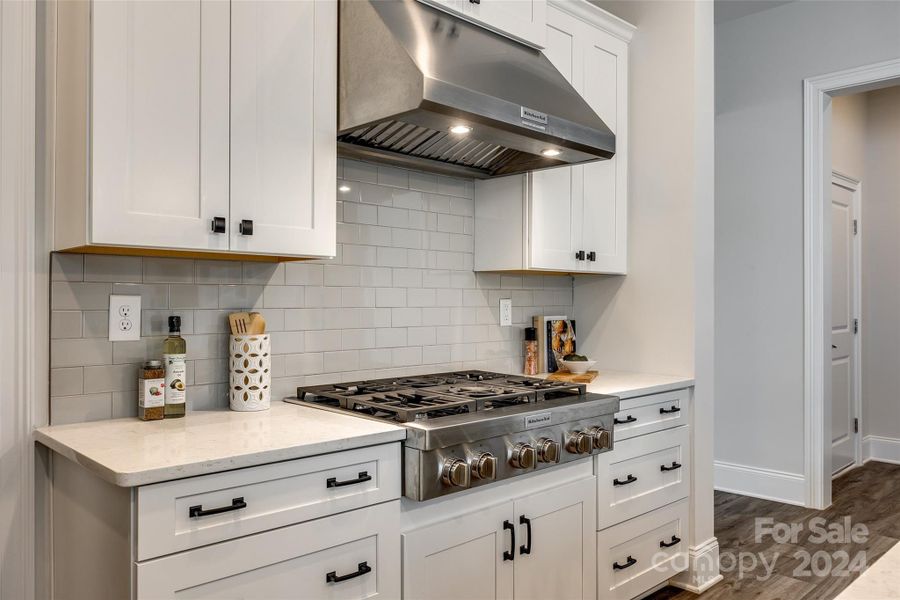 Gourmet kitchen area with upgraded gas cooktop.