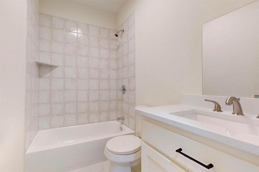 Full bathroom with vanity, toilet, and tub / shower combination