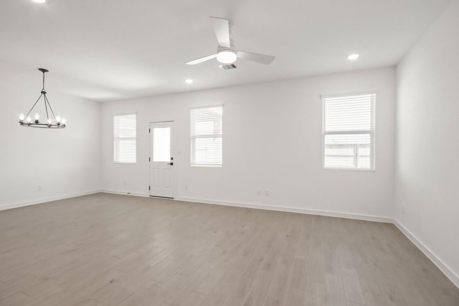 Open great room and dining area (*Photo not of actual home and used for illustration purposes only.)