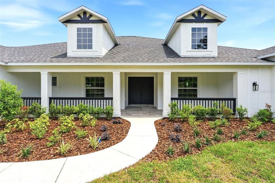 Front exterior of a new home in , Brooksville, FL, highlighting curb appeal (Image 24).