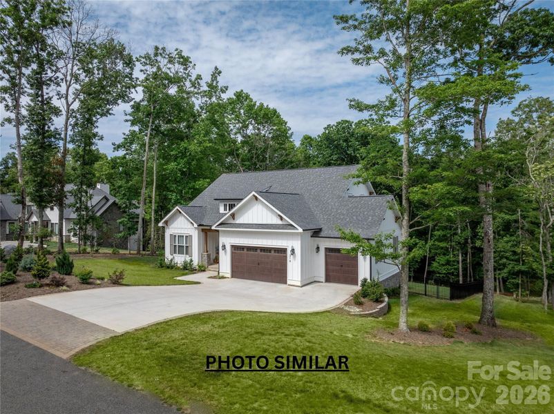 Front exterior of a new home in , Hendersonville, NC, highlighting curb appeal (Image 1). Front exterior of a new home in , Hendersonville, NC, highlighting curb appeal (Image 1).