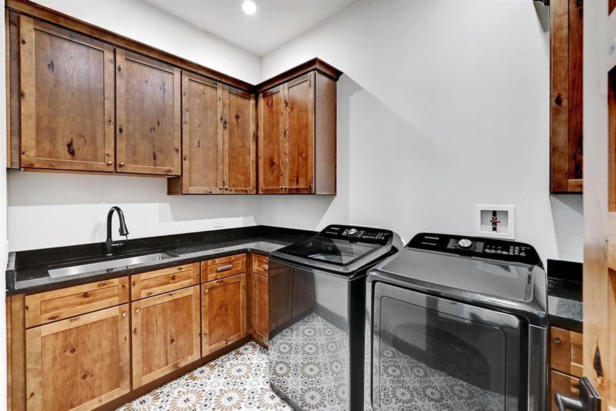 Laundry room with cabinet space, independent washer and dryer, and recessed lighting