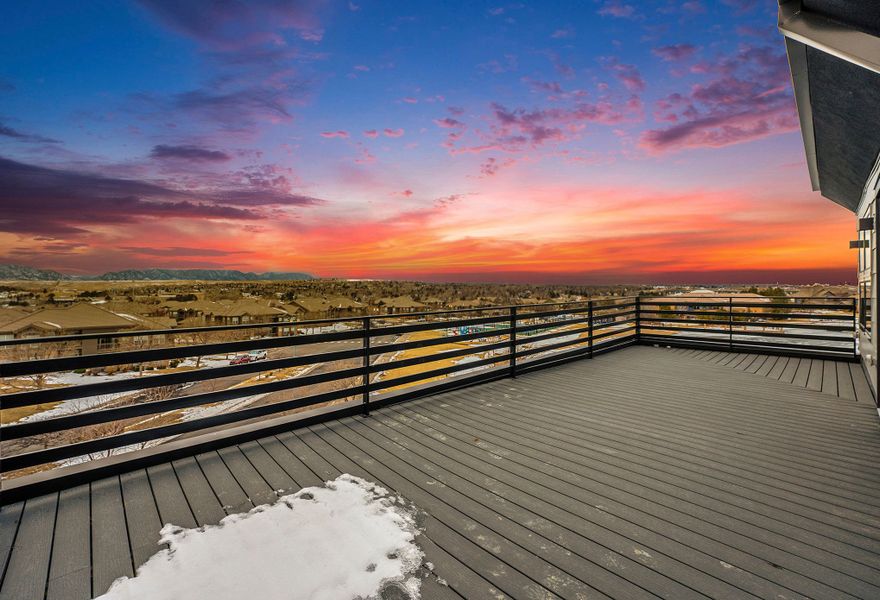 Mountain and water views of rooftop deck