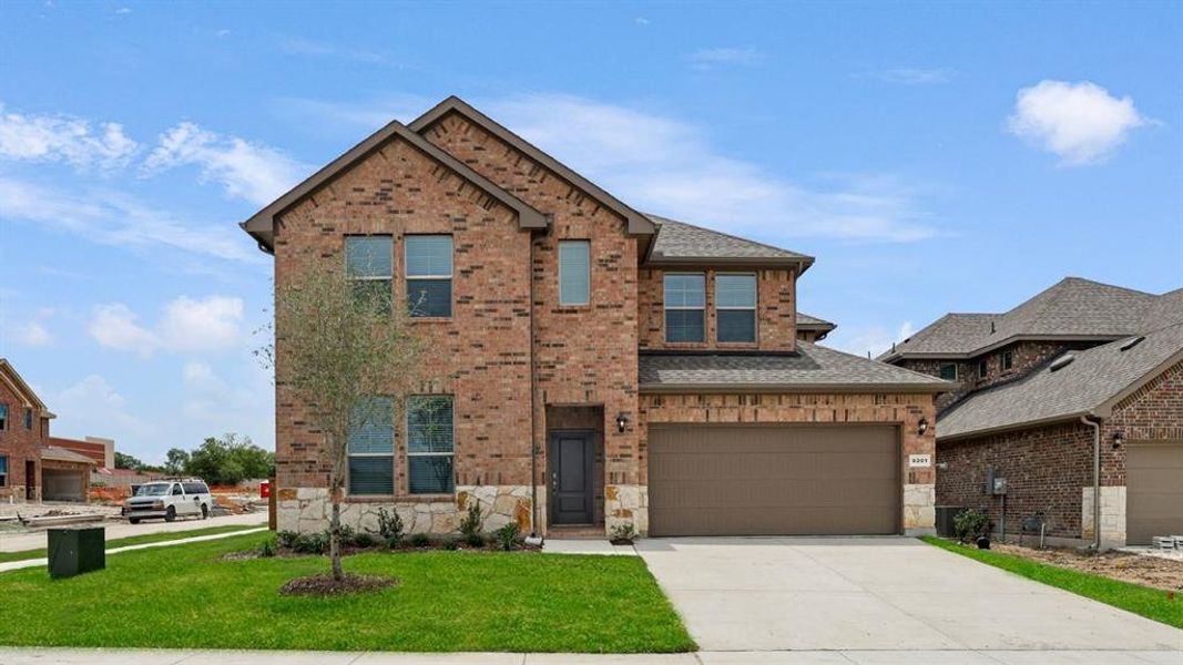 Front exterior of a new home in The Landing at Hidden Lakes, McKinney, TX, highlighting curb appeal (Image 1). Front exterior of a new home in The Landing at Hidden Lakes, McKinney, TX, highlighting curb appeal (Image 1).