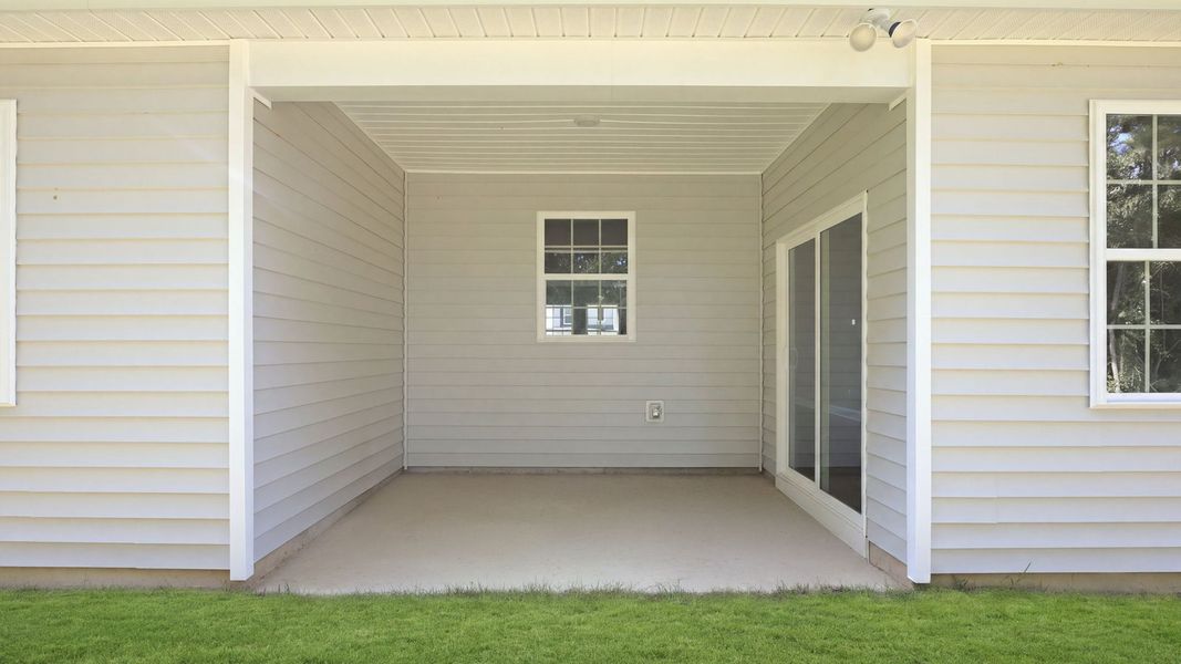 Exterior details and patio area of a home in Tyler - Home on the Lake, New Bern (Image 21).