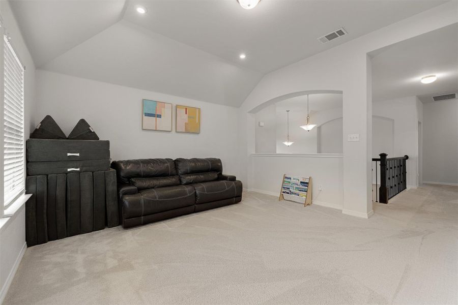 The upstairs guest bedrooms offer comfortable layouts with room for full