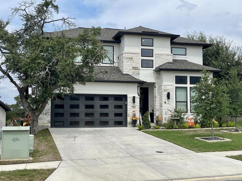 Front exterior of a new home in Vista Alta Del Veramendi, New Braunfels, TX, highlighting curb appeal (Image 23). Front exterior of a new home in Vista Alta Del Veramendi, New Braunfels, TX, highlighting curb appeal (Image 23).